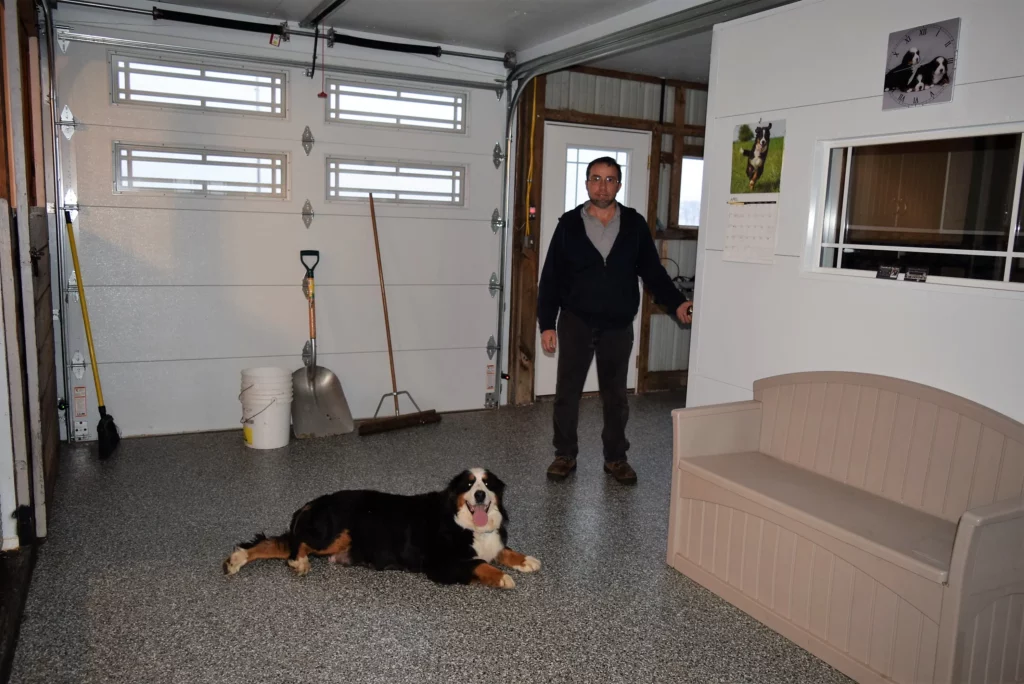 Man and his black tri-color dog